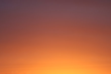 Illuminated sky by the rays of the sun, during sunrise.の写真素材