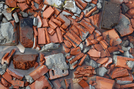 Construction debris, broken brick at a construction site.