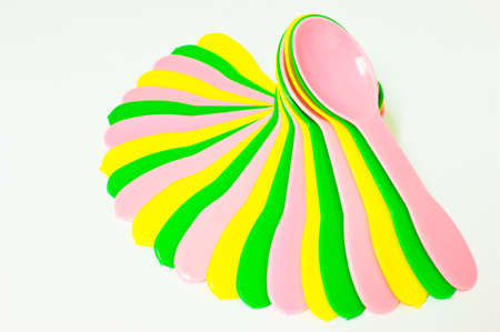 bright colour of plastic spoon pileの写真素材