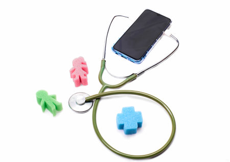 Representation of a man and a woman next to a cell phoneの写真素材