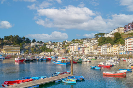 Fishing boats in the seaport of Luarca, Asturias, Spain on a sunny day.の写真素材