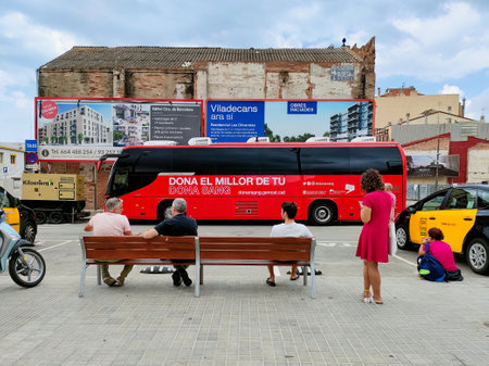 BARCELONA SPAIN - August 12, 2023: People waiting in front of the blood donation service vehicle parked outdoors to make their donation.のeditorial素材