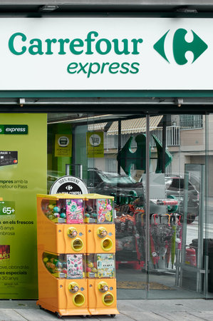 Viladecans, Spain - September 13, 2023: Entrance to Carrefour Express with some machines for children.のeditorial素材