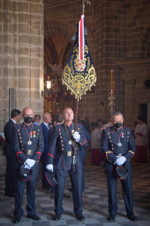 Jerez de la Frontera, Spain - February 16, 2024: Officers holding a banner during holy week in the...