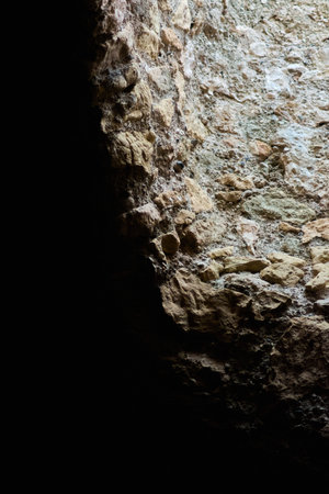 Close-up view of a stone window with intricate details and mixed colors, perfect for geology related content or natural decor.の写真素材