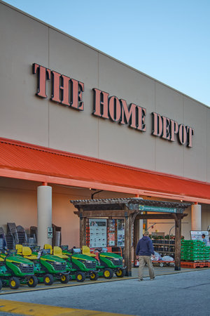 Florida, USA - March 23, 2024: Shot of a Home Depot store with a clear sky, showing the entrance filled with gardening tools and plants, inviting home improvement enthusiasts.のeditorial素材