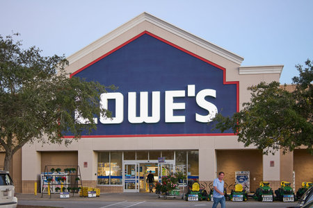 Florida, USA - March 23, 2024: Shot of a Lowe's store with a clear sky, showing the entrance filled...