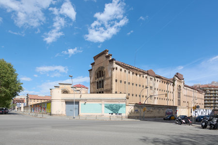 Barcelona, SPAIN - JULY 5, 2024: Barcelona Model Prison, a historic building with a beige facade and impressive architectural details. The clear blue sky provides a perfect contrast.のeditorial素材
