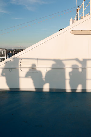 Abstract human shadows in golden lightの写真素材