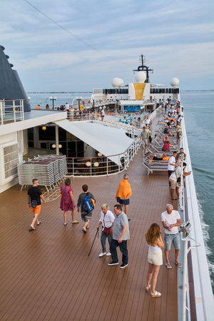 Venice. Italy - October 03, 2025: Passengers enjoying themselves on a cruise ship deck