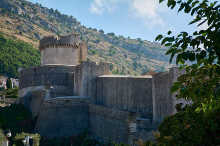 A view of the Minceta Tower, the highest point of the Dubrovnik city walls. The medieval stone fortress is a UNESCO landmark and a major tourist attraction.の写真素材
