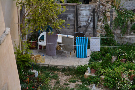 Authentic and simple lifestyle in Croatia. Laundry hanging in a charming backyard, showing local life in a travel destination.の写真素材