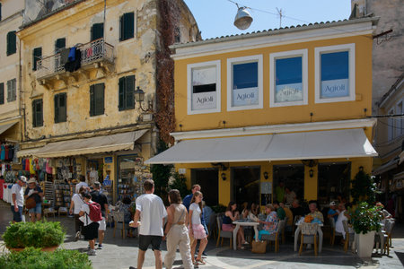Corfu. Greece - January 22, 2026: Diners enjoy Mediterranean cuisine at Agioli restaurant terrace in the historic UNESCO Old Town of Corfu, Greece.のeditorial素材