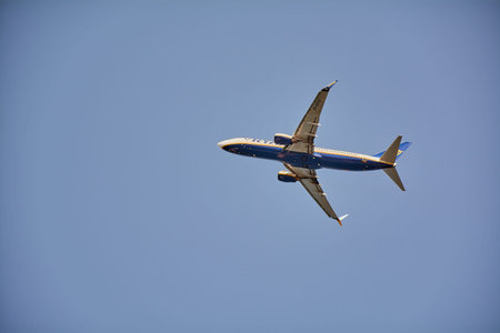 Corfu. Greece - January 29, 2026: Low angle perspective of a Ryanair aircraft in flight emphasizes...