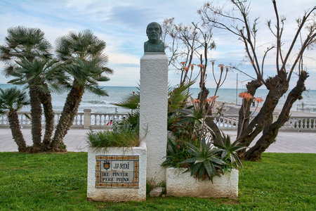 Sitges, Spain - February 12, 2026: Bust monument of painter Pere Pruna in Jard del Pintor overlooking the Mediterranean Sea and promenadeのeditorial素材