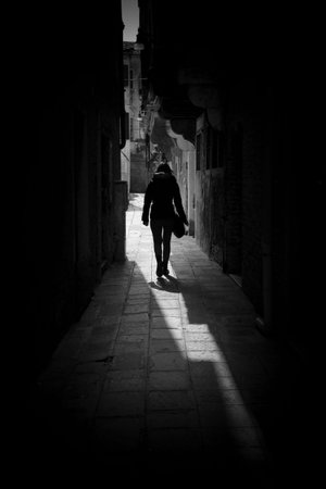 The girl in the shadowの写真素材