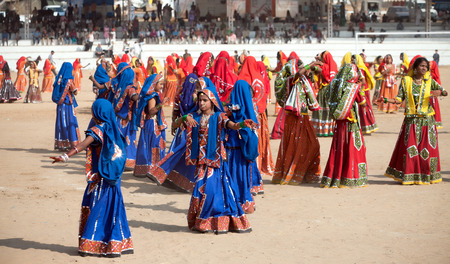 PUSHKAR, INDIA - NOVEMBER 21: An unidentified  Indian girls in colorful ethnic attire dancing at Pushkar fair, Rajasthan, India.のeditorial素材