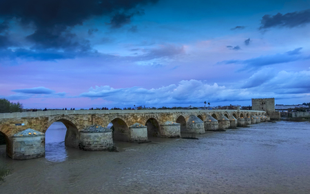 Cordoba - Roman bridge and Torre de Calahorra in the evening. Cordoba, Andalucia, Spainの写真素材
