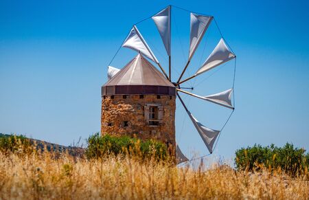 Old windmill in the mountains on the island of Crete, Greece.の写真素材