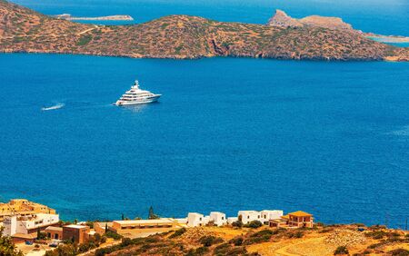 Large luxury white yacht off the coast of Crete, Greece.の写真素材