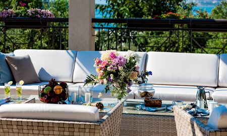 breakfast on the veranda of a luxurious garden home.の写真素材