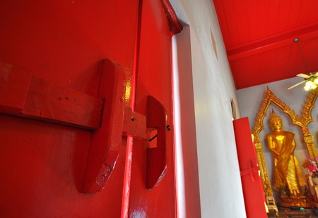 old style wood latch in thai buddhist churchの写真素材