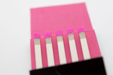 Pink matches on a white background
