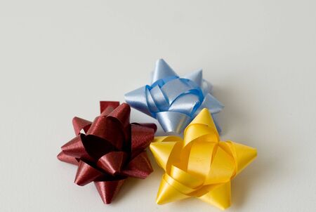 colourful gift wrap bows can be used as a backgroundの写真素材