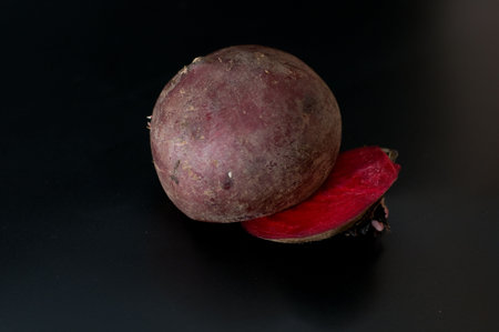 raw sliced  beetroot isolated on black