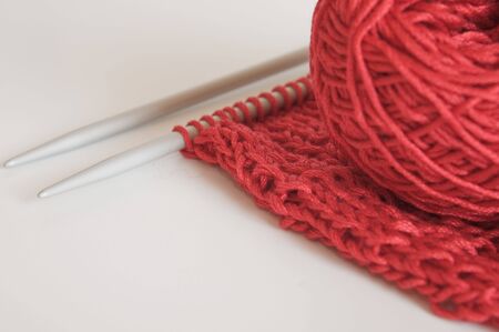 light cotton knitting piece and yarn with pair of knitting needlesの写真素材