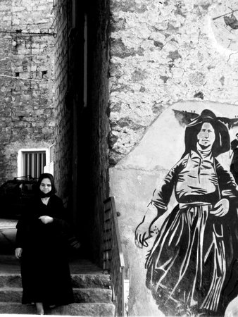 old woman in old town                               の写真素材