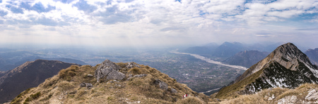 At the summit of Monte Chiampon, right Monte Deneal, left Monte Cuarnan in Italy in springの写真素材