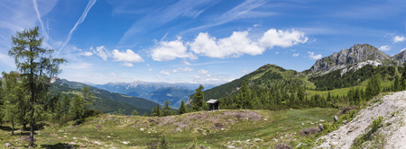Nassfeld in Carnic Alps with mountain Gartnerkofel and High Tauern with Grossglockner in the backgroundの写真素材