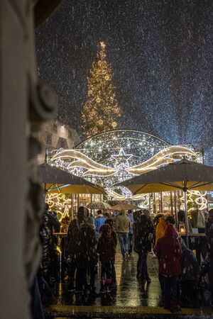 Snowfall on Christmas market Christkindlmarkt on main square in Graz, Styria, Austriaのeditorial素材