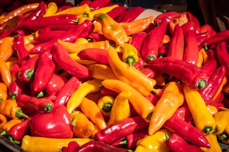 Big pile of fresh red, orange, yellow paprikas, peppers on a fruit market stall in Zagreb, Sloveniaの写真素材