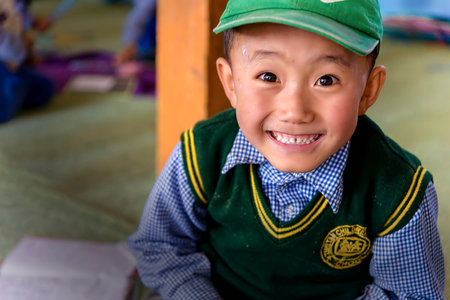 Leh, India - August 24, 2015: View of a smiling tibetan student in SOS Children's Village school. SOS Children's Village is an integrated educational community for destitute Tibetan children in exile.のeditorial素材