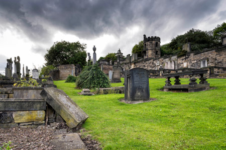 Edinburgh, United Kingdom - August 15, 2014: The Old Calton burial ground under dramatic sky. Located at Calton Hill, this burial ground, opened in 1718, is the resting place of several notable Scots.のeditorial素材