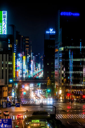 Tokyo, Japan - April 21, 2014: Night view of Chuo-dori. This is the main shopping street in the Ginza area. The street is home to many department stores, flagship brand shops, restaurants and cafes.のeditorial素材