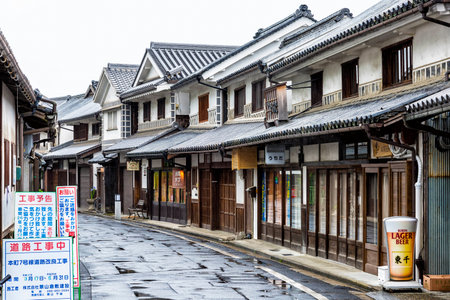 Kurashiki, Japan - April 28, 2014: View of Bikan historical area. It is the old merchant quarter and contains many examples of 17th century wooden warehouses painted white with traditional black tilesのeditorial素材