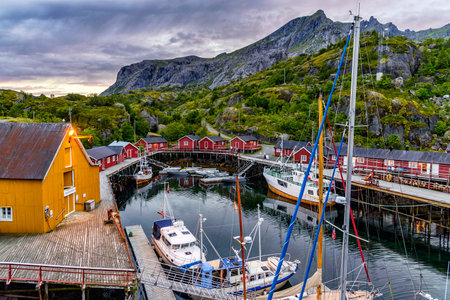 Nusfjord, Norway - August 20, 2016: View of the harbor under dramatic sky. Nusfjord is one of the oldest and best preserved fishermen village of Norway. It is located on the Lofoten Islandsのeditorial素材