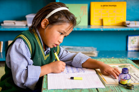 Leh, India - August 24, 2015: View of a concentrated tibetan student in SOS Children's Village school. Children's Village is an integrated educational community for destitute Tibetan children in exileのeditorial素材