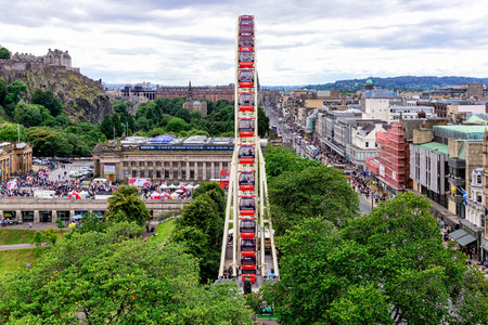 Edinburgh, United Kingdom - August 15, 2014: View of  the Festival Wheel, a large and temporary mechanical Ferris Wheel, situated in the centre of Edinburgh, in East Princes Street Gardenのeditorial素材
