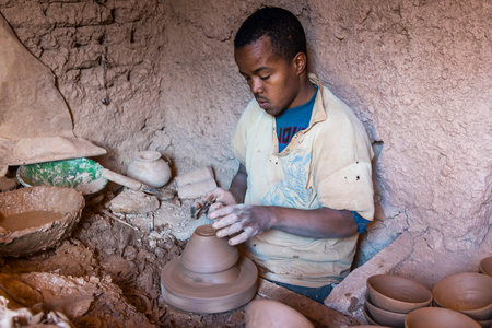 Tamegroute, Morocco - December 27, 2017: An unidentified man making clay pots with ancient techniques. Tamegroute pottery are known for its distinct green and brown glazeのeditorial素材