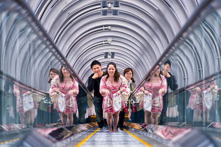 Osaka, Japan - April 29, 2014: People in escalator going to the viewing platform of Umeda Sky Building, a modern high rise skyscraper in the Kita district of Osaka, near Umeda Stationsのeditorial素材