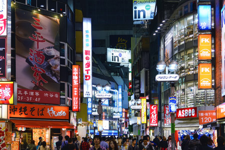 Tokyo, Japan - April 21, 2014: View of Shibuya district at night. Shibuya is known as one of the fashion centers of Japan, particularly for young people, and as a major nightlife areaのeditorial素材