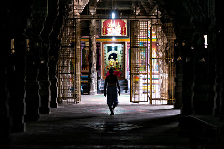 Kanchipuram, India - August 19, 2018: A brahmin walking to a hindu shrine inside the Ekambareswarar temple in Tamil Nadu stateのeditorial素材