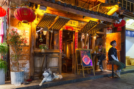 Dali, China - April 25, 2019: A characteristic restaurant at evening in old Town. The old town has become well-known as a tourist site thanks to its picturesque location and historic Bai architectureのeditorial素材