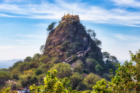 View of Mount Popa in Myanmar. Mount Popa is an extinct volcano of 1518 metres (4981 feet) above sea level. Now is a pilgrimage site, with numerous Nat temples and relic sites atop the mountainのeditorial素材