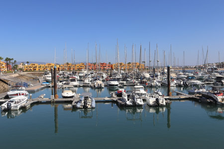 Marina of Portimao with Yachts and Colorful Waterfront Houses, Algarve, Portugalの写真素材