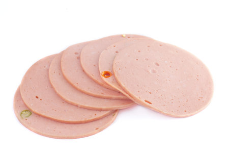 slices of ham isolated on the white background の写真素材